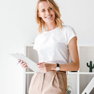 smiling-businesswoman-holding-folder-8PBUAH4.jpg